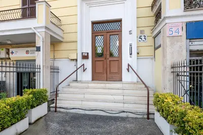 a front door of a building with stairs at Pigneto House - Residenze Romanae in Rome