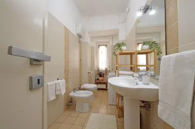 a bathroom with a sink and a toilet at Victoria Apartment in Rome