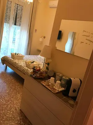 a bedroom with a dresser with a mirror on it at Da Giulia in Rome