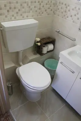a bathroom with a white toilet and a sink at Da Giulia in Rome