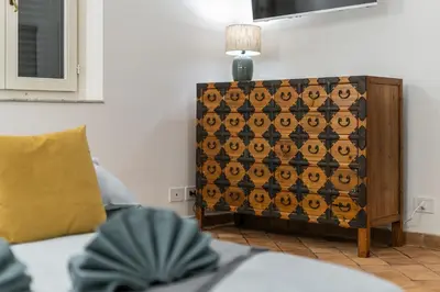 a room with a wooden wine crate with a lamp on it at Apartment AppiaAntica in Rome