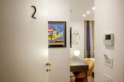 a door to a room with a painting on the wall at Santaluna in Rome