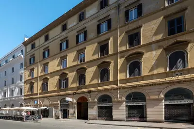 a large building with many windows on a street at Laura Roof Terrace Teatro dell'Opera in Rome