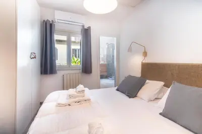 a bedroom with two beds and a window at Laura Roof Terrace Teatro dell'Opera in Rome