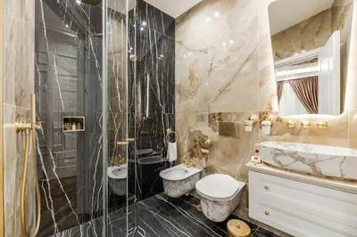 a bathroom with a toilet and a shower and a sink at La Bella Trevi in Rome