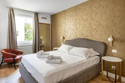 a bedroom with a bed with towels on it at 3 bedroom superior apartment Trastevere in Rome