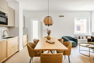 a kitchen and dining room with a table and chairs at 3 bedroom superior apartment Trastevere in Rome