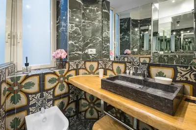 a bathroom with a sink and a toilet at DOMUS Generale Ezio in Rome