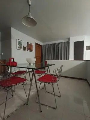 a dining room with a glass table and chairs at casaemily TrenoFiumicinoAir-VillaBonelli-Ostiense in Rome