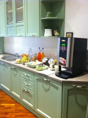 a kitchen counter with food and a microwave on it at Le Scalette Al Vaticano B&B in Rome
