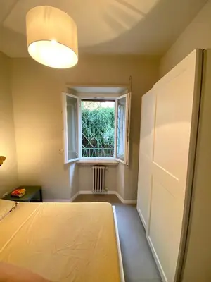 a bedroom with a bed and a window at Balduina Boutique Apartment in Rome