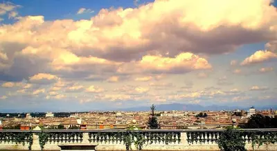 a view of a city under a cloudy sky at Villa Sciarra BnB in Rome