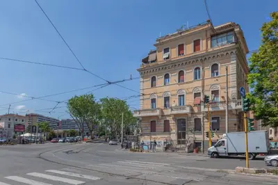 a building on the corner of a city street at Trastevere Tranquility Rome in Rome
