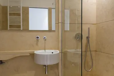 a bathroom with a sink and a shower at La Casa Di Iulia in Rome