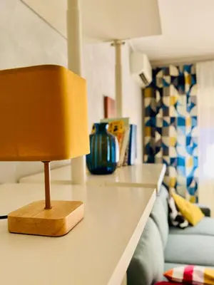 a yellow lamp sitting on a counter in a living room at Step to the Vatican in Rome