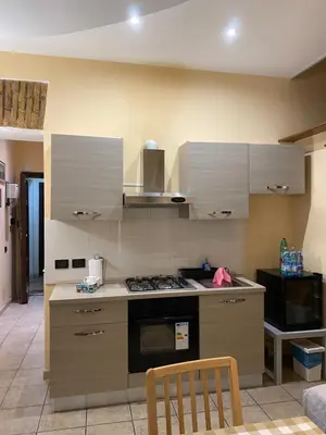a kitchen with a stove and a counter top at Family Apartment for five persons in Rome