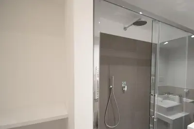 a bathroom with a shower and a sink at Vantaggio Apartment in Rome