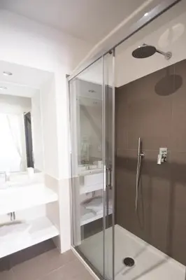a bathroom with a shower and a sink at Vantaggio Apartment in Rome