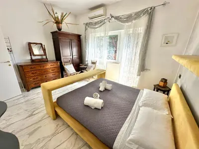 a bedroom with a bed with two towels on it at Penthouse Luxe - Rome in Rome