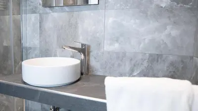 a white sink on a counter in a bathroom at Suites 215 Colosseum - Guesthouse in Rome