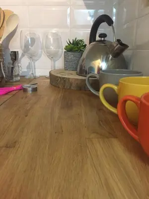 a kitchen counter with two cups and wine glasses at Trastevere Holiday Home in Rome