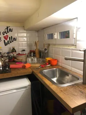 a kitchen with a sink and a counter top at Trastevere Holiday Home in Rome