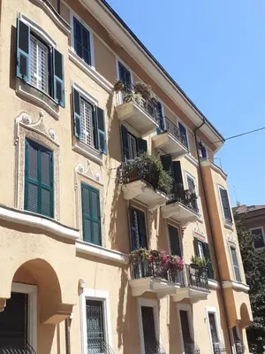 a building with balconies and flower boxes on it at Loft Capodistria, Rome, in Rome