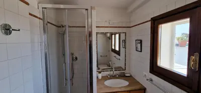 a bathroom with a shower and a sink and a mirror at Nox Romana Apartment - Polyclinic Gemelli - Penthouse with Large Panoramic View Terrace in Rome
