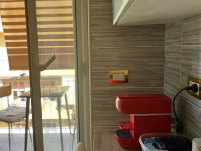 a stack of red suitcases sitting in a room at SR Guesthouse in Rome