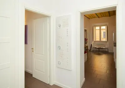 a room with a white door and a hallway at Germanico Maxi in Rome