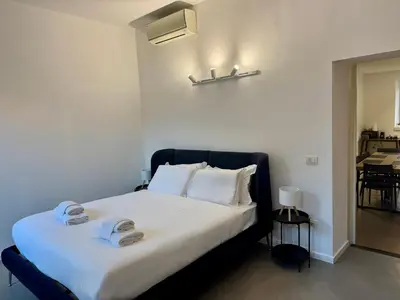 a bedroom with a bed with two towels on it at Rome design and fitness stay - Pantheon and Trevi in Rome