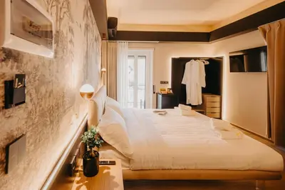 a bedroom with a large white bed in a room at Guest House Praesidium in Rome