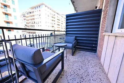 a balcony with a bench and a table on a building at Guest House Praesidium in Rome