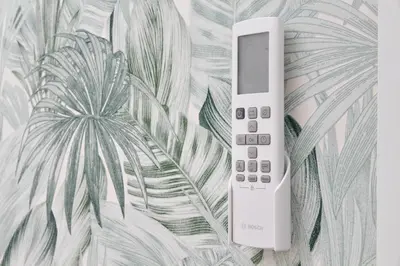a remote control sitting on top of a wall at Domus Sinuessa in Rome