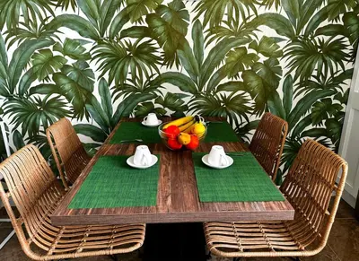 a wooden table with bananas and a bowl of fruit on it at MarbleApartment in Rome