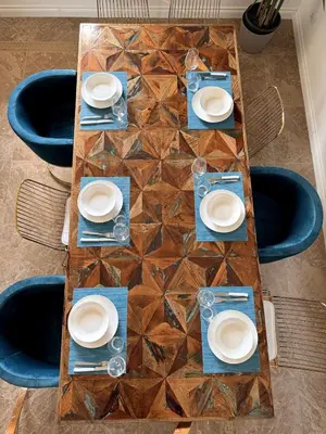 a wooden table with white plates on it at MarbleApartment in Rome