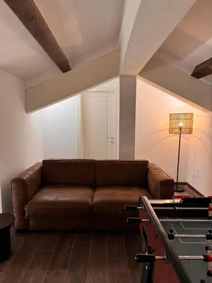 a living room with a couch and a pool table at MarbleApartment in Rome