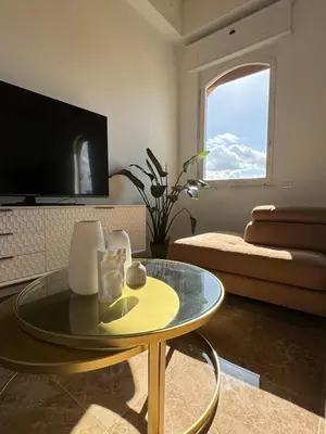 a living room with a table and a couch at MarbleApartment in Rome