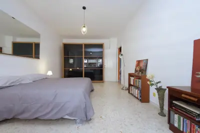 a bedroom with a bed and a tv in it at Pascarella - Trastevere in Rome