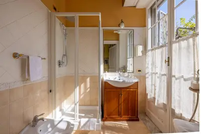 a bathroom with a sink and a shower at Residenza Episcopo Lipinsky 1902 in Rome