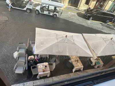 an overhead view of a table and chairs with umbrellas at Apt Aurea Domus al Pantheon in Rome