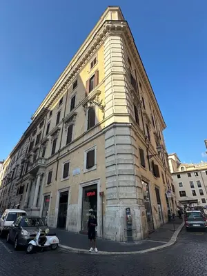 a person is standing in front of a building at Apt Aurea Domus al Pantheon in Rome