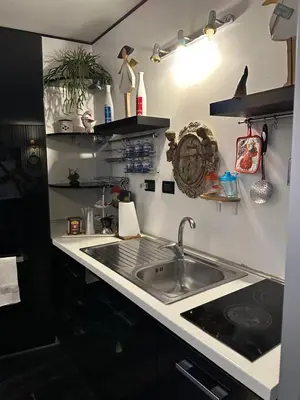 a kitchen with a sink and a counter top at Apt Aurea Luxury Pantheon View in Rome
