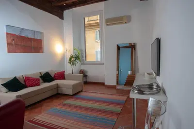a living room with a couch and a table at Pantheon-Rondanini - Cozy Apartment in Rome