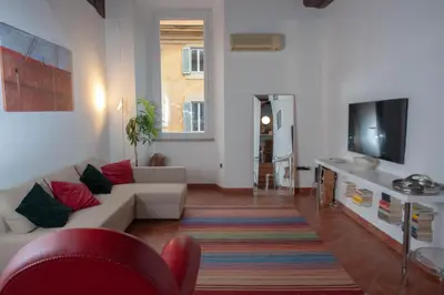 a living room with a couch and a tv at Pantheon-Rondanini - Cozy Apartment in Rome