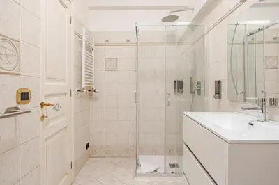 a bathroom with a sink and a shower at Family House 10 Min Metro Conca d'Oro in Rome
