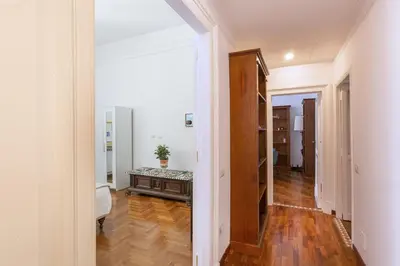 a hallway with a table in the middle of a room at Maison Haysée Piazza del Popolo in Rome