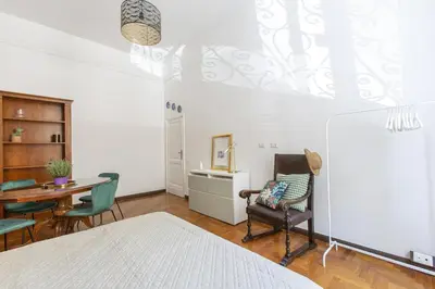 a living room with a table and chairs at Maison Haysée Piazza del Popolo in Rome