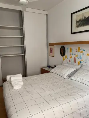 a bedroom with two beds with towels on them at GeNa Home, a due passi da San Giovanni in Rome