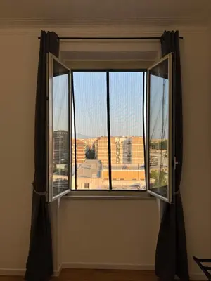 a window with a view of a city at Tito House in Rome